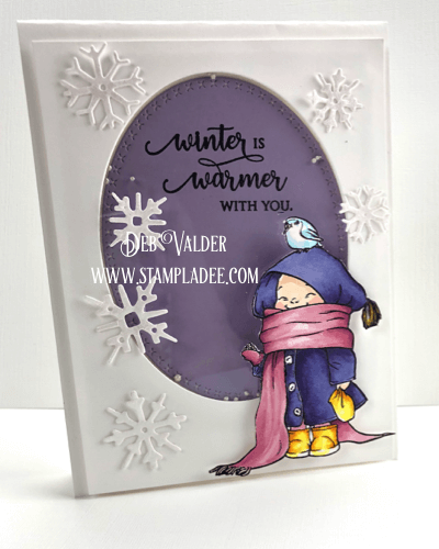 Bundles little person feeding a bird on a snowy day in a shaker card