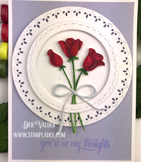 Red Roses are paired with Stitched square and circles for a beautiful card