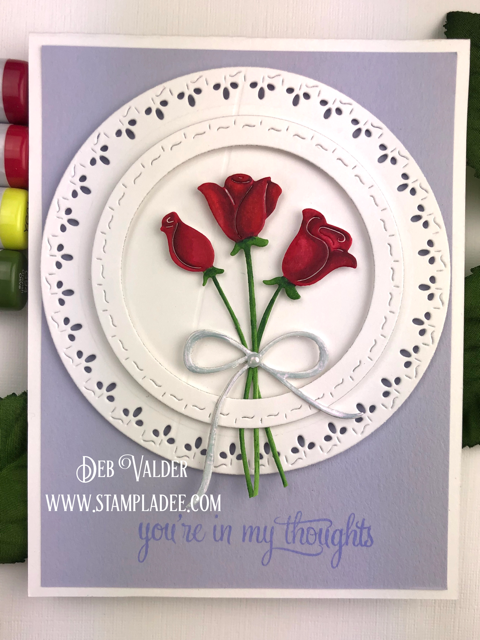 Red Roses are paired with Stitched square and circles for a beautiful card